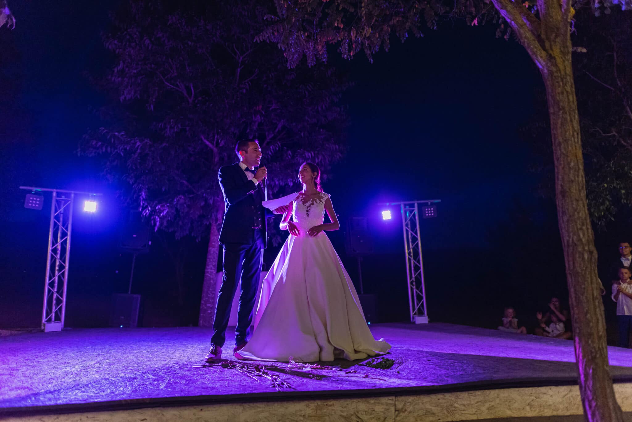 The bride and groom prepare to open the wedding ball with a short speech.